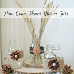 Pine cone embellished mason jars