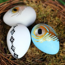 Add a little paint and a temporary tattoo for these gorgeous modern Easter eggs by Uncommon Designs