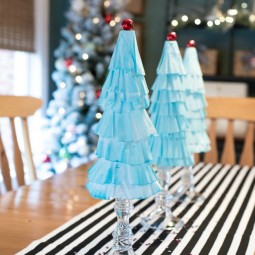 Coffee Filter Christmas Trees are the easiest Christmas decoration you will make this year! Grab some coffee filters and a little paint... the perfect kids holiday craft! | Uncommon Designs